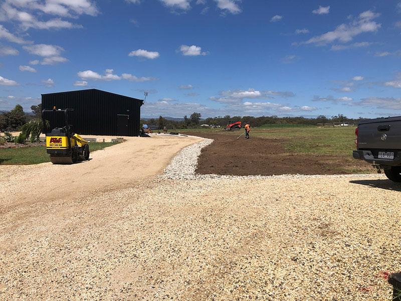 Excavation contractors delivering a crushed rock driveway 