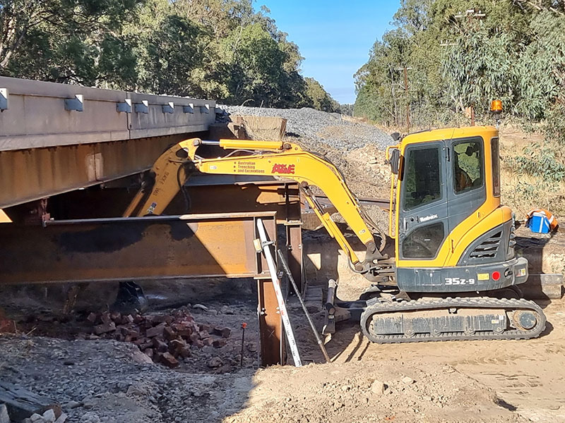 Excavator performing site cuts in Central Victoria