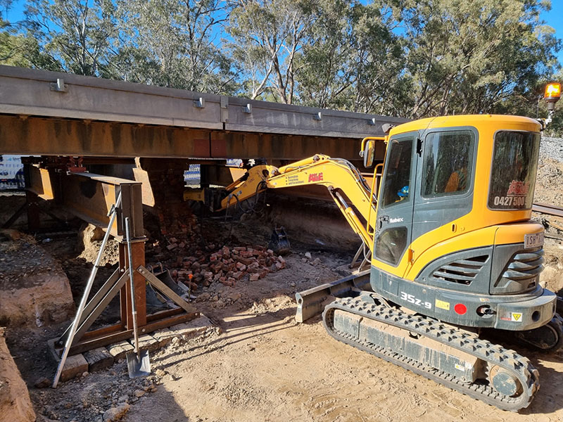 Excavator performing site cuts in Central Victoria