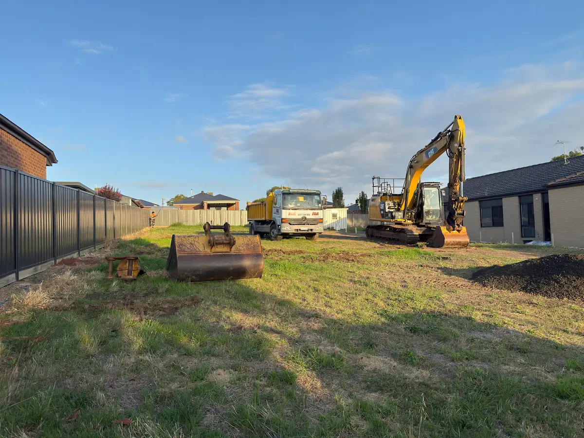 Excavator performing site cuts in Central Victoria